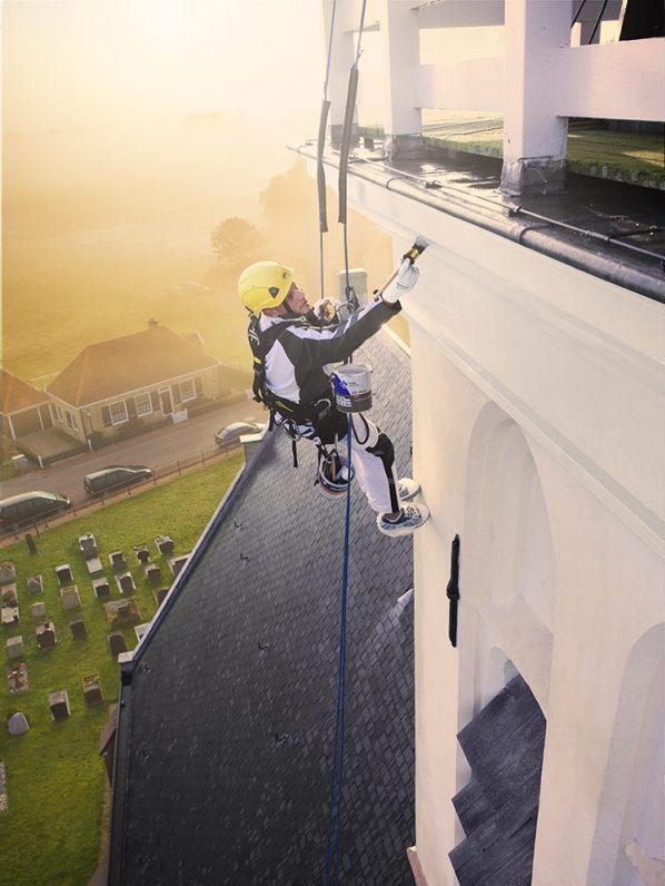 Pro gold painter church abseiling morning light sun painting